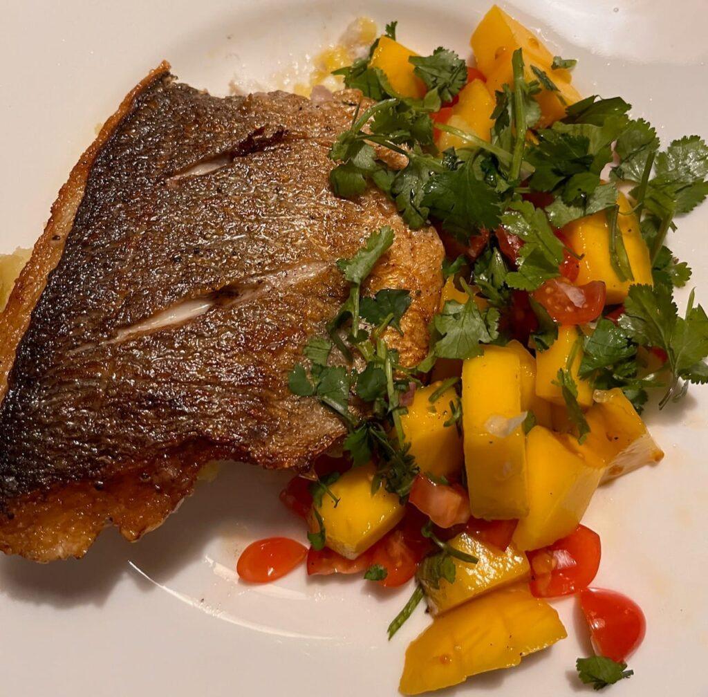 Pan fried dorado with crushed potatoes and a mango and tomato salsa.