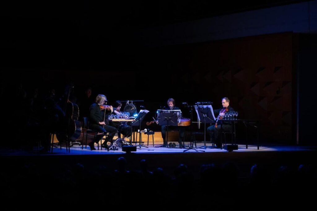 A quartet playing in the darkness