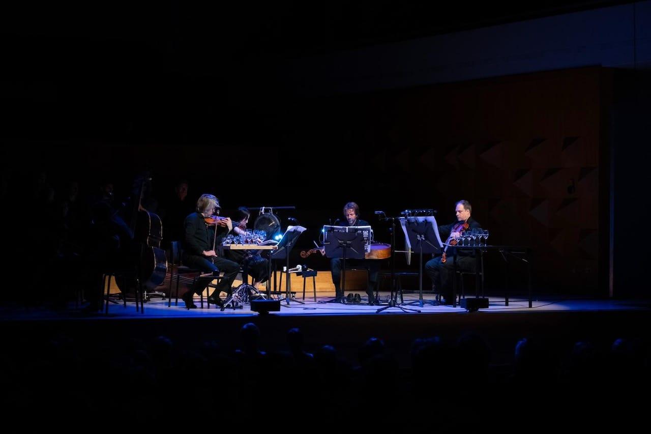A quartet playing in the darkness