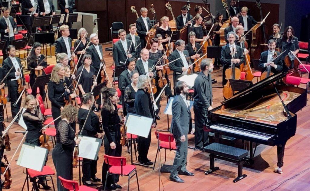 Daniil Trifonov taking the applause with the conductor André de Ridder