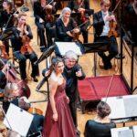 Claus Peter Flor and Katerina Bradić inviting the post horn soloist, Bob Koerthuis, onto the stage to take the applause