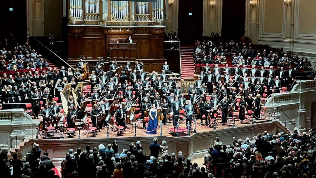Taking a bow | Soprano, Lenneke Ruiten with baritone, Christian Gerhaher and conductor Dinis Sousa © Clare Varney