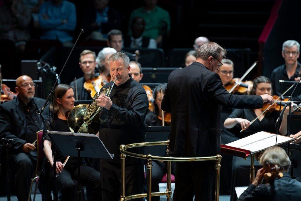 Sefan Dohr giving the UK premiere of the Hans Abrahamsen Horn Concerto at the BBC Proms 2024 with the BBC Philharmonic and John Storgårds