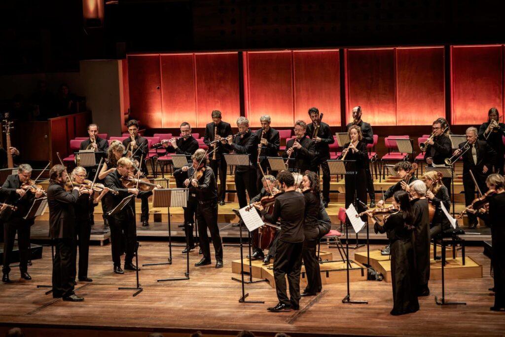 orchestra playing standing up