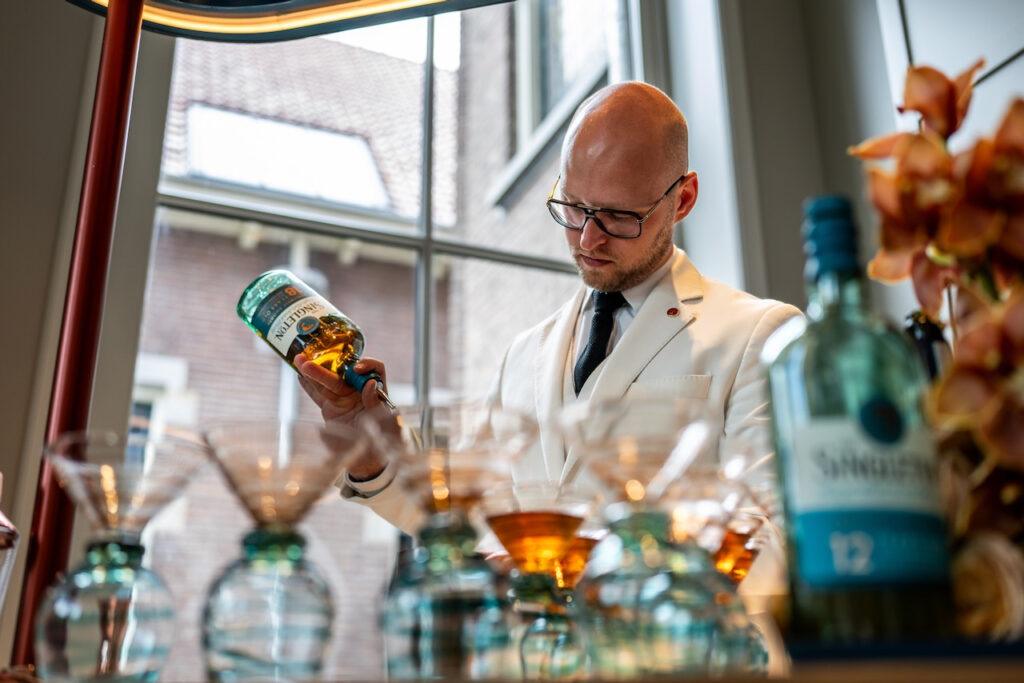 Man pouring whisky
