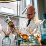 Man pouring whisky