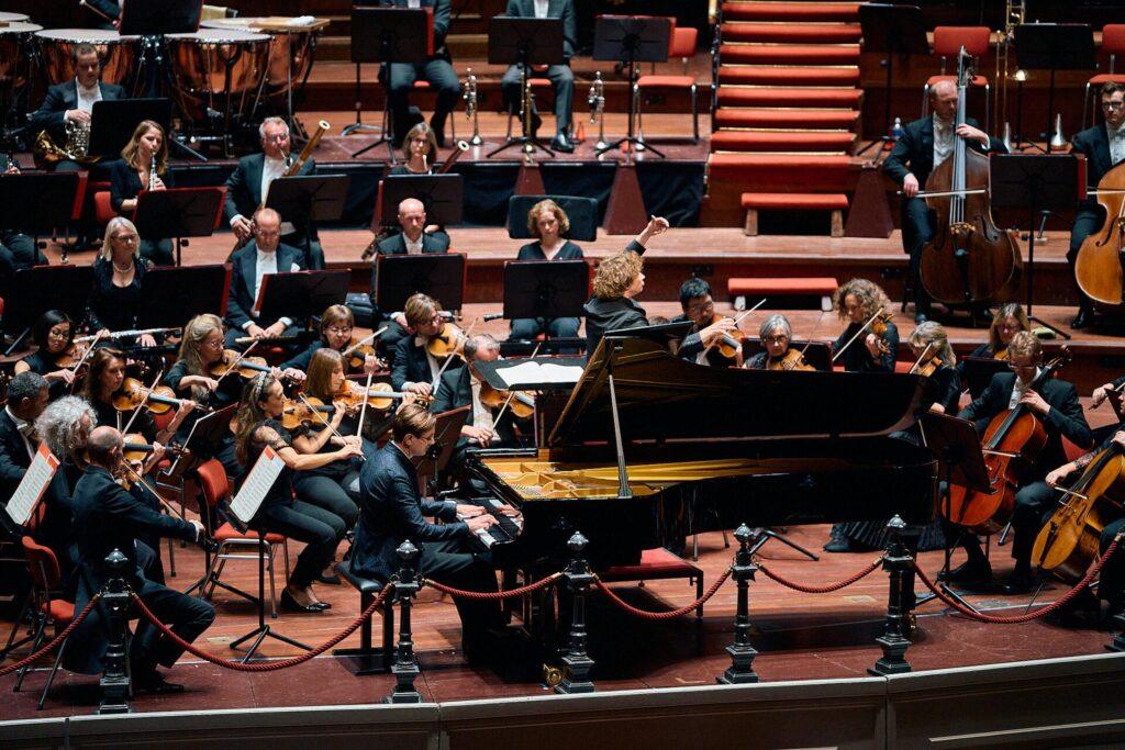Vikingur Olafsson plays the piano with the Philarmonia