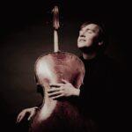 Ivan Karizna holding his cello